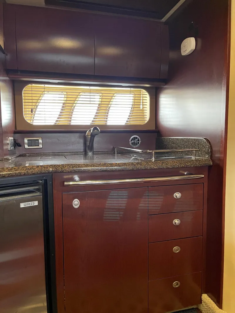 Slide: The Image of Interior of 2007 Sea Ray 380 Sundancer featuring elegant kitchen. - 31