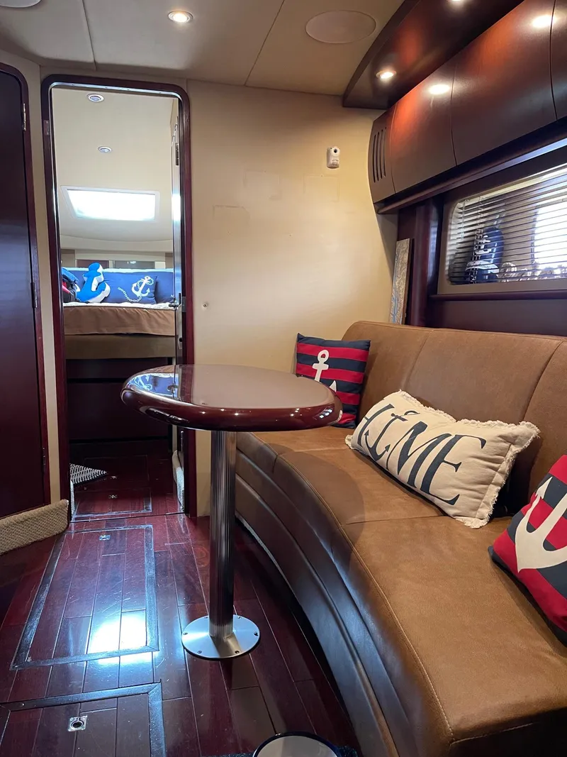 Slide: The Image of Interior of a 2007 Sea Ray 380 Sundancer yacht with cozy seating area. - 34