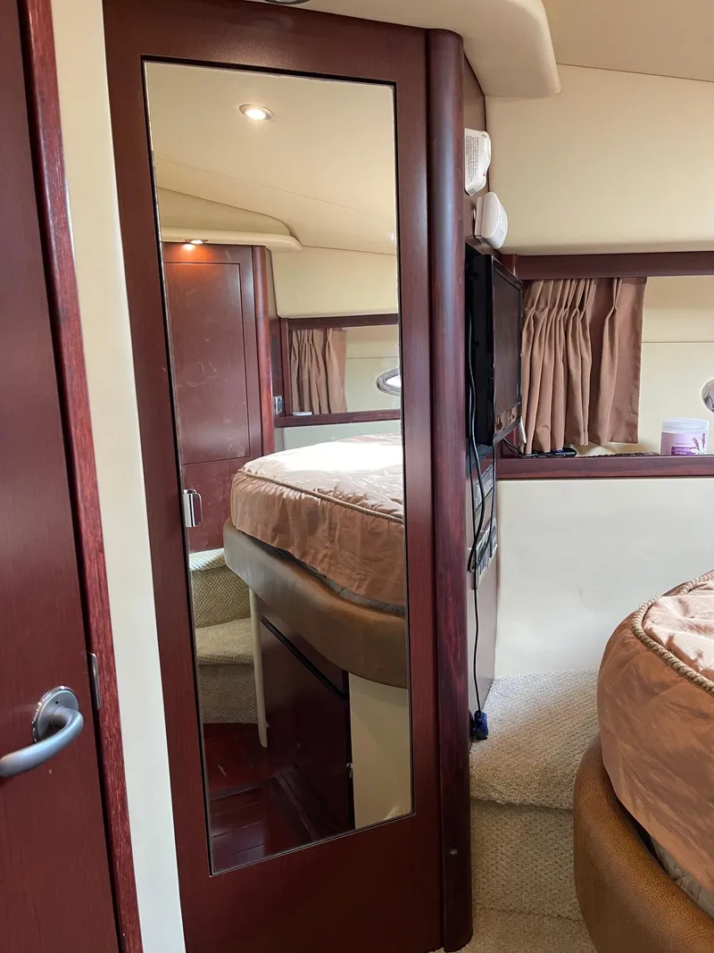 Slide: The Image of Interior of 2007 Sea Ray 380 Sundancer with mirror and bed. - 36