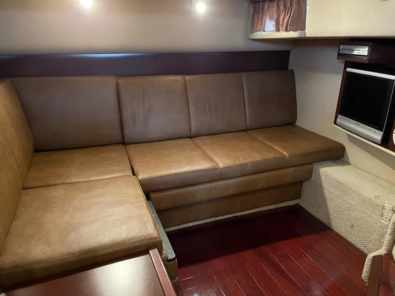 Slide: The Image of Interior of 2007 Sea Ray 380 Sundancer with leather sofa and TV. - 41