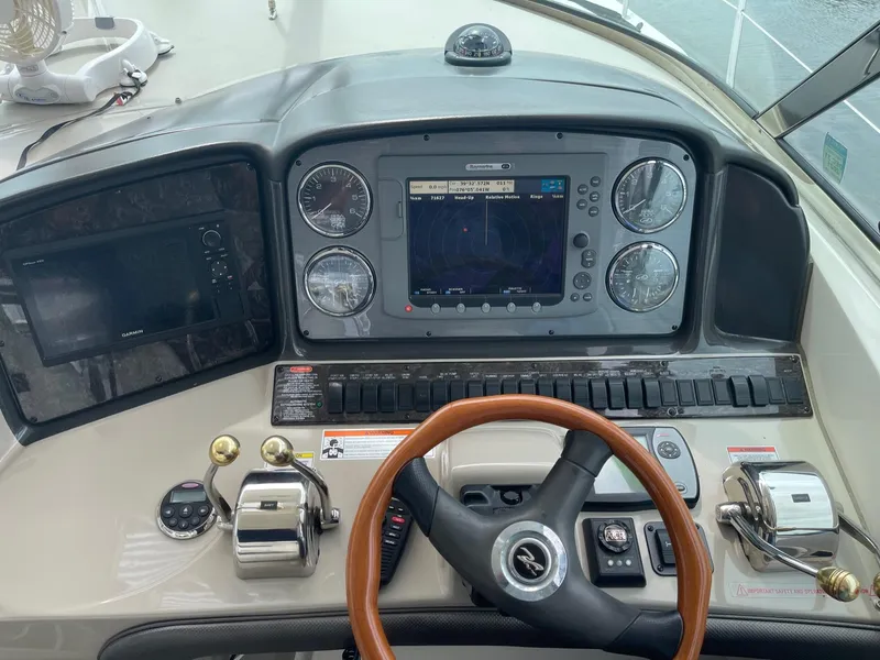 Slide: The Image of 2007 Sea Ray 380 Sundancer helm with navigation system. - 6