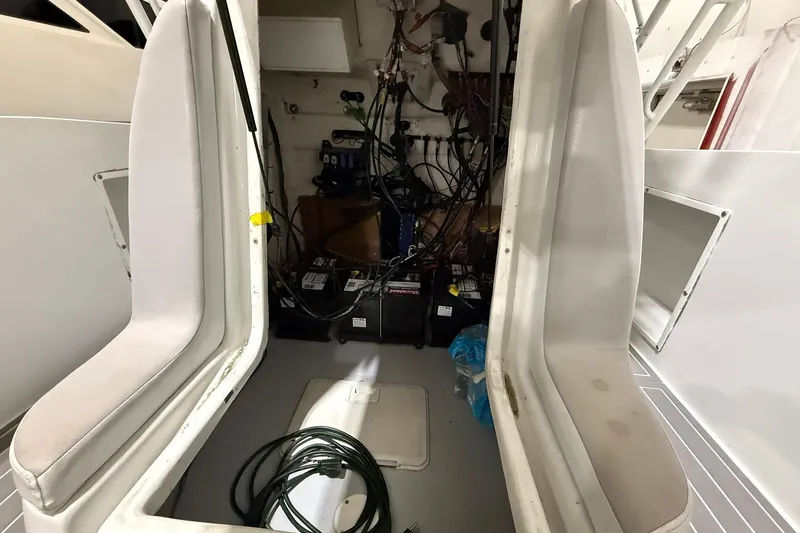 Slide: The Image of Interior view of a 1988 Stamas 255 Tarpon boat showing seating and wiring. - 15