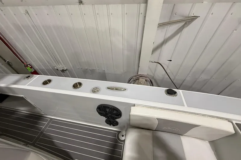 Slide: The Image of 1988 Stamas 255 Tarpon boat interior with rod holders and seating. - 20