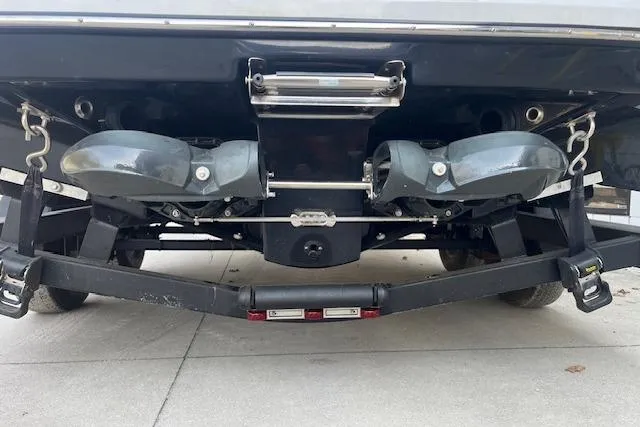 Slide: The Image of Rear view of 2021 Scarab 215 ID boat on trailer, showcasing dual jet propulsion system. - 22