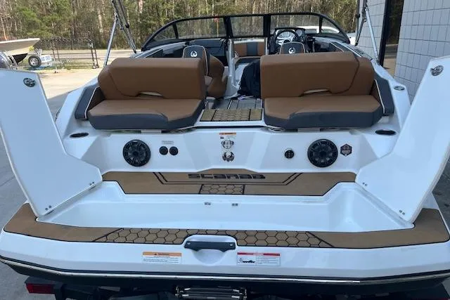 Slide: The Image of 2021 Scarab 215 ID boat with open rear seating and modern design. - 23