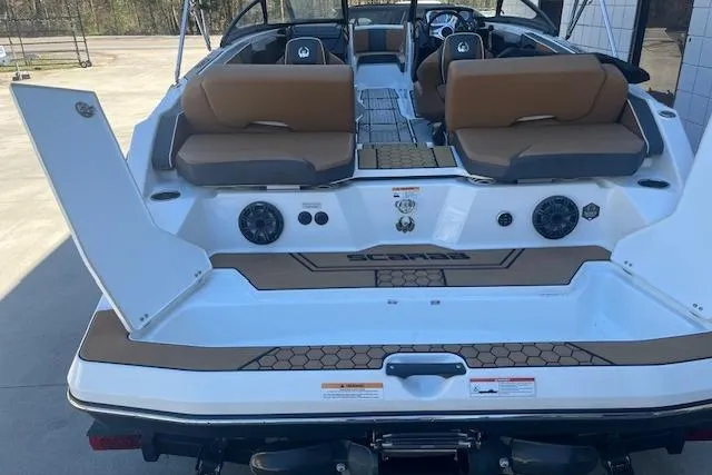 Slide: The Image of 2021 Scarab 215 ID boat with tan seating and modern design features. - 29