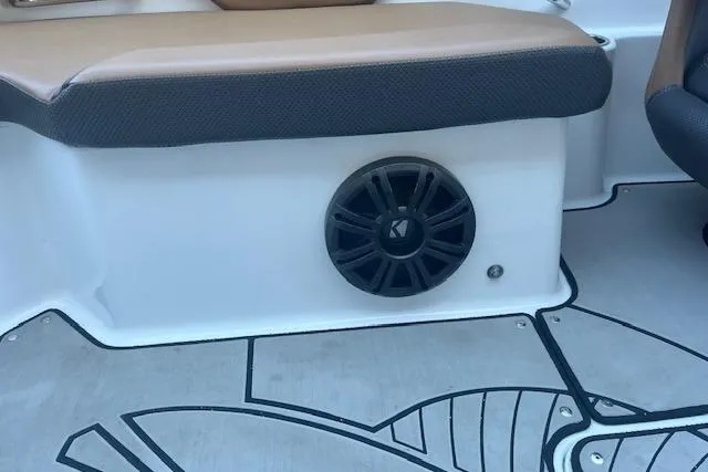 Slide: The Image of 2021 Scarab 215 ID boat interior with speaker and cushioned seating. - 37