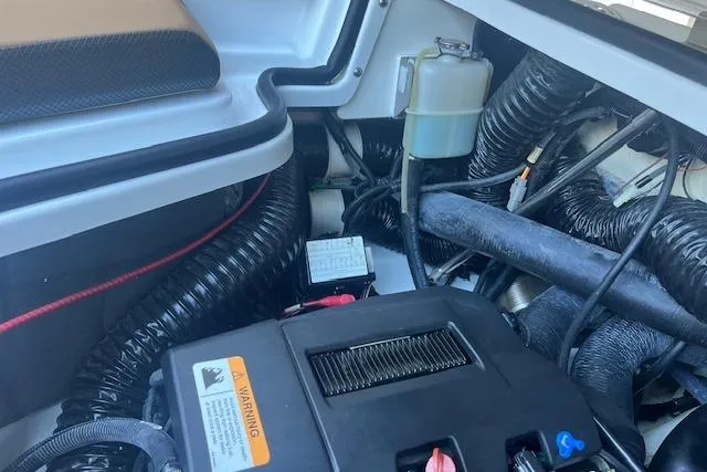 Slide: The Image of Engine compartment of a 2021 Scarab 215 ID boat, showcasing wiring and components. - 40