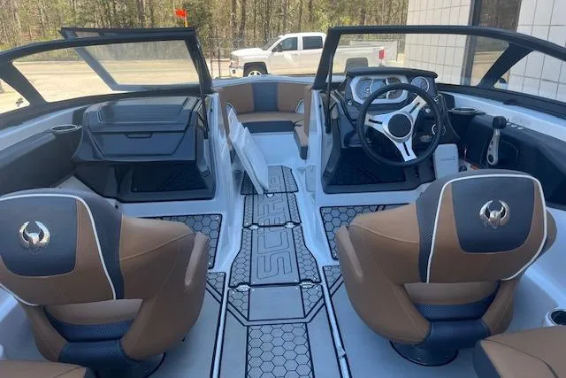 Slide: The Image of Interior view of 2021 Scarab 215 ID boat with modern seating and dashboard. - 42