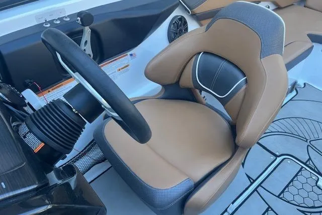Slide: The Image of Steering wheel and seat of 2021 Scarab 215 ID boat, featuring modern design and comfort. - 45