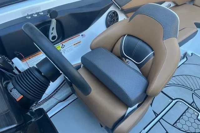 Slide: The Image of 2021 Scarab 215 ID boat interior with steering wheel and cushioned seat. - 46