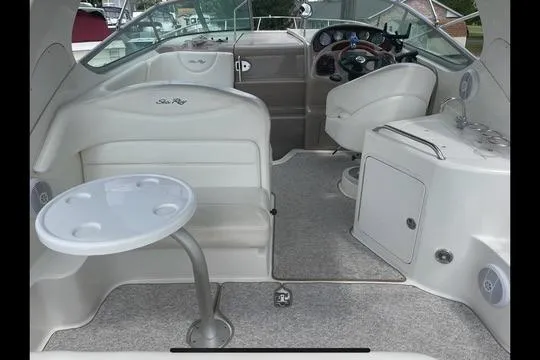 Slide: The Image of Interior of a 2004 Sea Ray Sundancer 280 boat with seating and helm. - 10