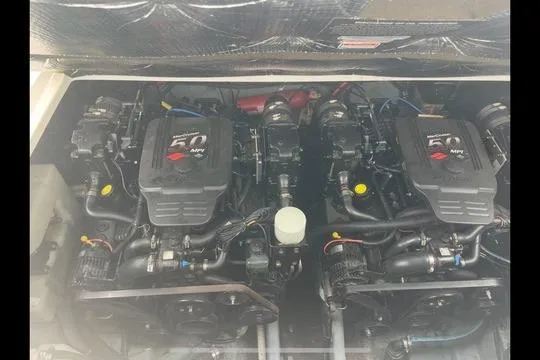 Slide: The Image of Twin engines of a 2004 Sea Ray Sundancer 280 boat, showcasing mechanical details. - 4