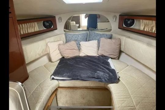 Slide: The Image of Interior cabin of 2004 Sea Ray Sundancer 280 with cozy seating and cushions. - 6