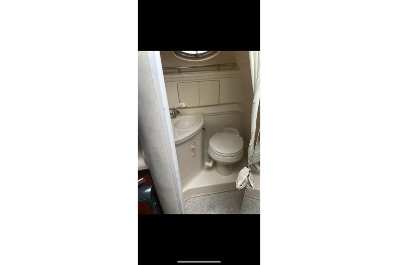 Slide: The Image of 2004 Sea Ray Sundancer 280 bathroom with sink and toilet. - 7