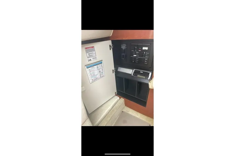 Slide: The Image of Electrical panel inside a 2004 Sea Ray Sundancer 280 boat cabin. - 9