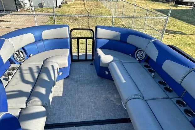 Slide: The Image of 2023 Montara 23 Surf Boss 2.0 CW interior with blue and gray seating. - 10