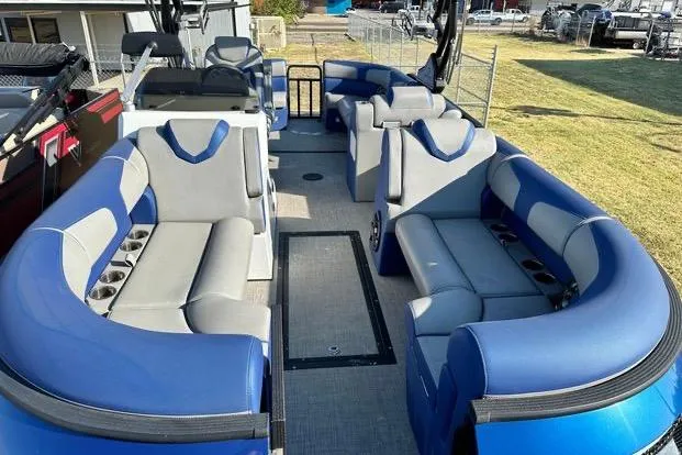 Slide: The Image of 2023 Montara 23 Surf Boss 2.0 CW boat interior with blue and gray seating. - 12