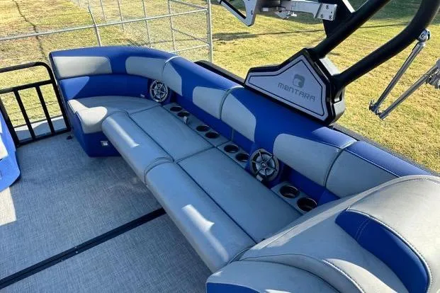 Slide: The Image of 2023 Montara 23 Surf Boss 2.0 CW boat interior with blue and gray seating. - 8