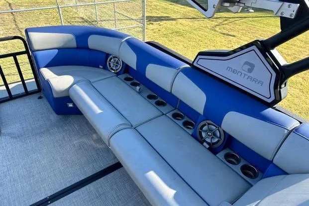 Slide: The Image of 2023 Montara 23 Surf Boss 2.0 CW boat interior with blue and gray seating. - 9