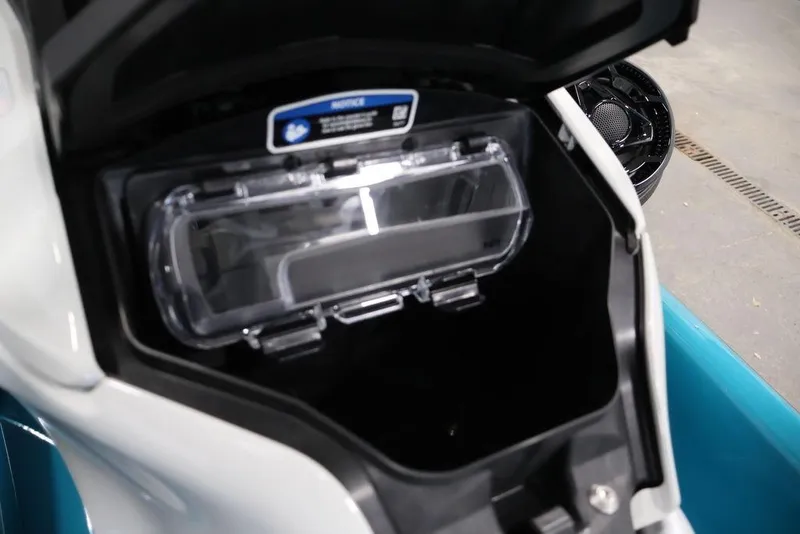 Slide: The Image of 2025 Sea-Doo GTI SE 170 storage compartment with open lid, showcasing interior space. - 12