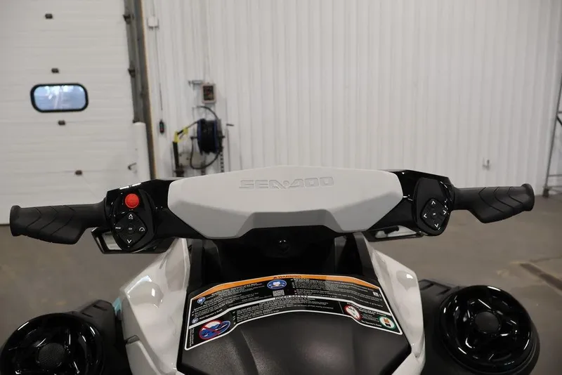 Slide: The Image of 2025 Sea-Doo GTI SE 170 handlebars in a garage setting. - 16