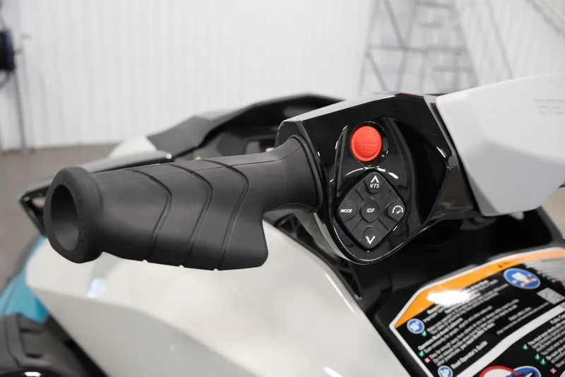 Slide: The Image of Close-up of 2025 Sea-Doo GTI SE 170 handlebar controls in a showroom. - 13