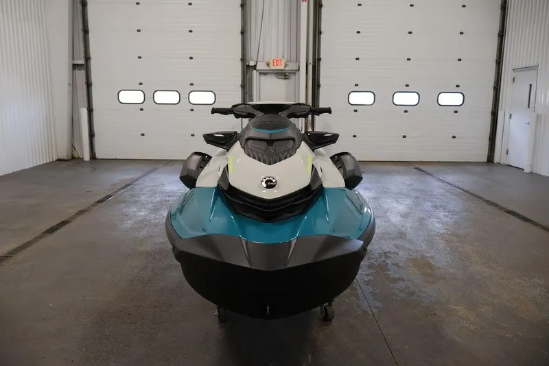 Slide: The Image of 2025 Sea-Doo GTI SE 170 jet ski in a garage, front view. - 3