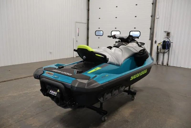 Slide: The Image of 2025 Sea-Doo GTI SE 170 jet ski in a garage setting. - 4