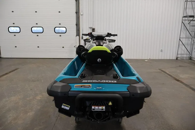 Slide: The Image of 2025 Sea-Doo GTI SE 170 jet ski in a garage, rear view. - 7