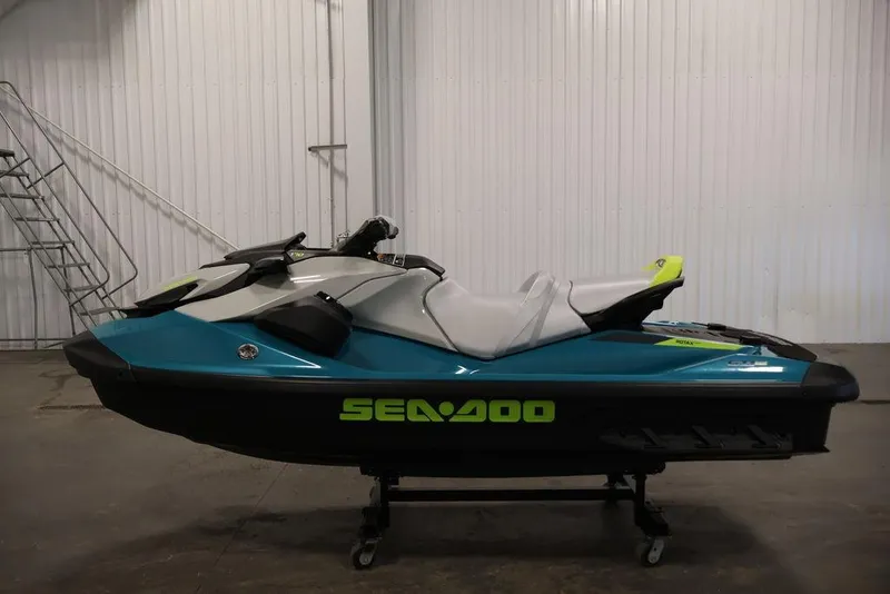Slide: The Image of 2025 Sea-Doo GTI SE 170 jet ski in a showroom, side view. - 8