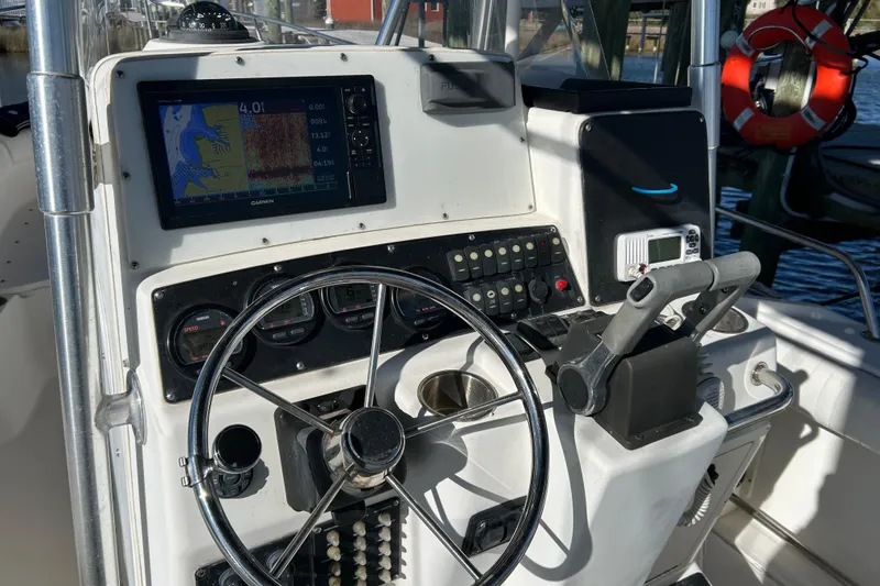 Slide: The Image of Control panel of a 2002 Boston Whaler 260 Outrage boat with navigation equipment. - 6