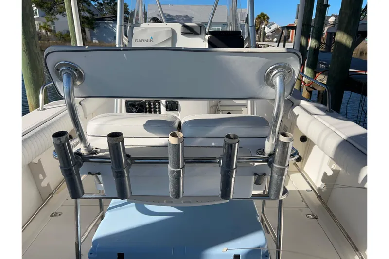 Slide: The Image of 2002 Boston Whaler 260 Outrage boat interior with rod holders and Garmin equipment. - 8