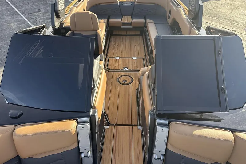 Slide: The Image of 2026 Supra SE 550 boat interior with luxurious seating and sleek design. - 12