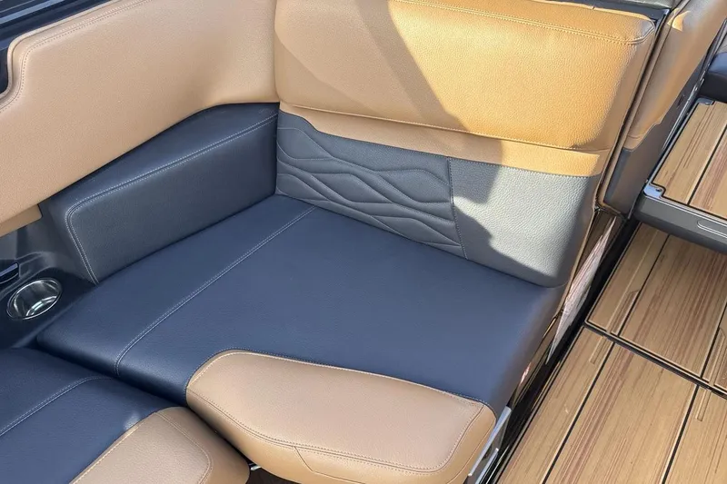 Slide: The Image of 2026 Supra SE 550 interior seating with brown and black leather upholstery. - 17