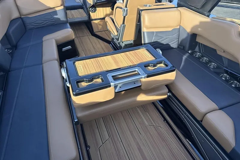 Slide: The Image of Luxurious interior of 2026 Supra SE 550 boat with premium seating and wood accents. - 22