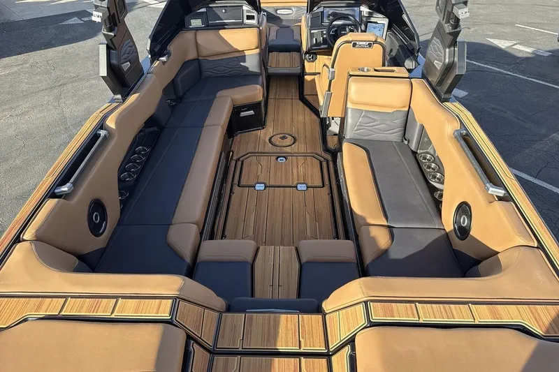 Slide: The Image of Luxurious interior of 2026 Supra SE 550 boat with tan and black seating. - 9