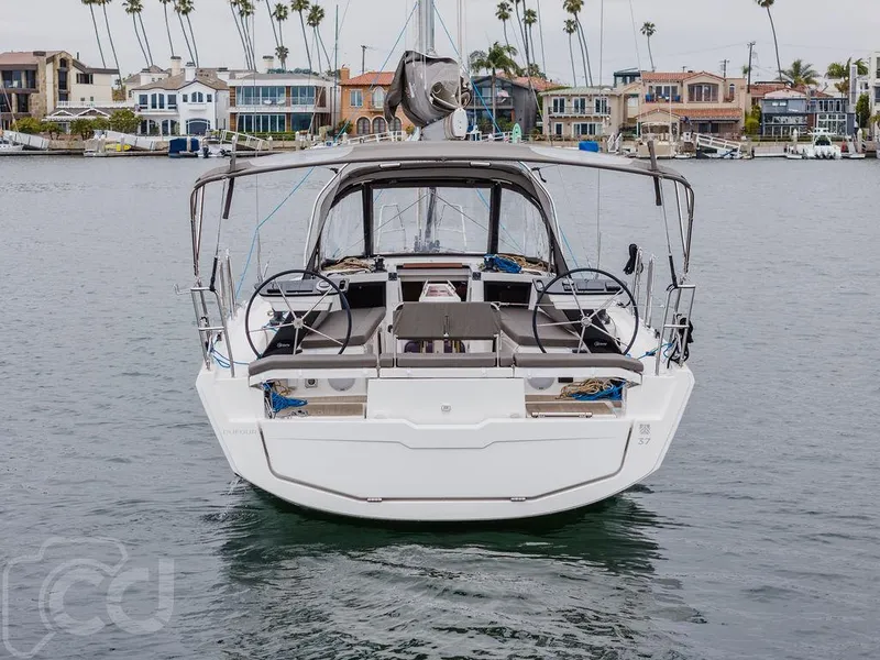 Slide: The Image of 2023 Dufour 37 yacht cockpit with seating and wooden table, featuring modern design elements. - 17