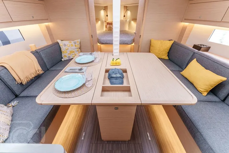 Slide: The Image of Interior of 2023 Dufour 37 yacht, featuring modern kitchen and cozy seating area. - 23