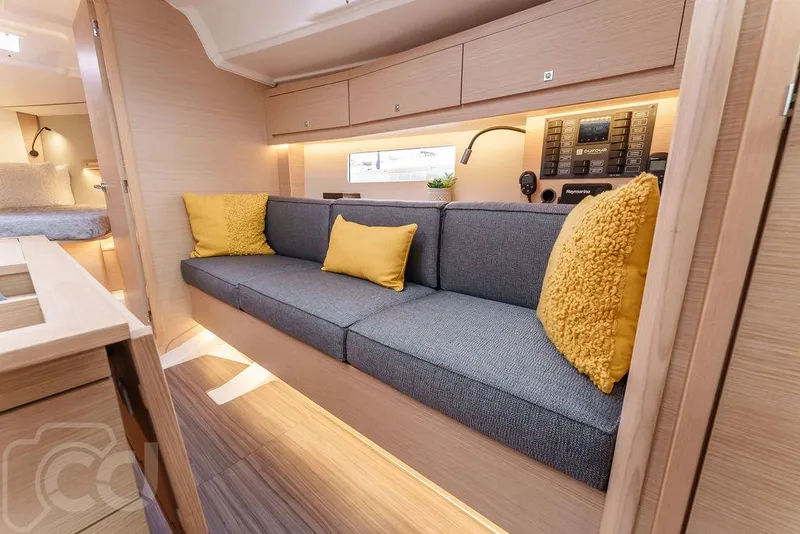 Slide: The Image of Modern interior of 2023 Dufour 37 yacht, featuring sleek kitchen and dining area. - 24