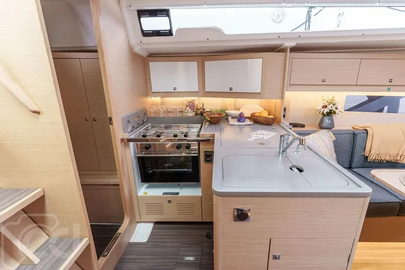 Slide: The Image of Modern interior of 2023 Dufour 37 yacht with cozy dining area and bedroom. - 25