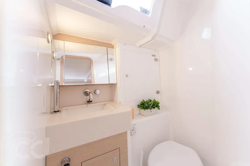 Slide: The Image of Modern bathroom interior of 2023 Dufour 37 yacht, featuring sleek design and compact amenities. - 39