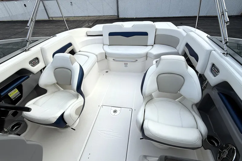 Slide: The Image of Interior of a 2013 Chaparral 246 SSi boat with white seating and modern design. - 10