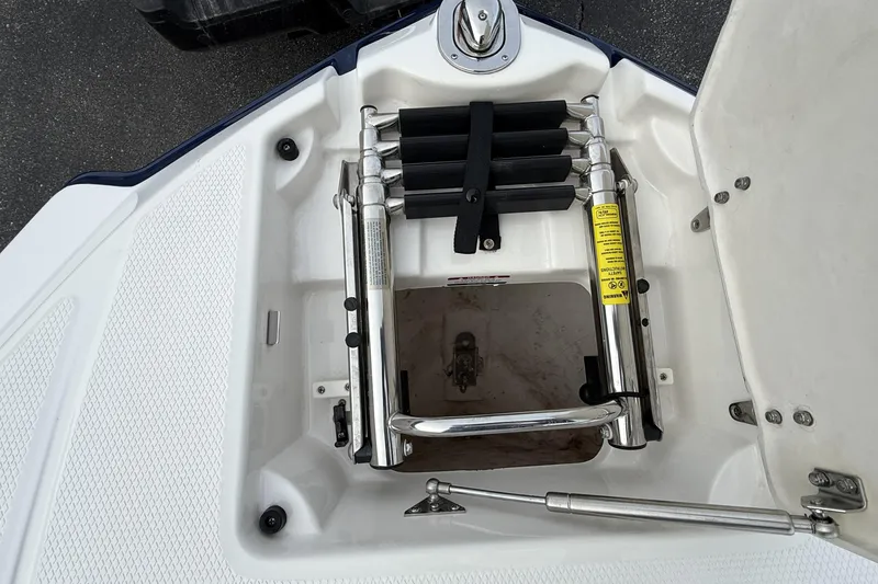 Slide: The Image of 2013 Chaparral 246 SSi boat ladder compartment with stainless steel hardware. - 19