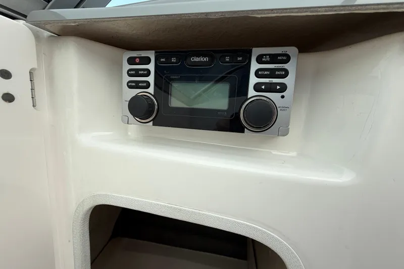 Slide: The Image of Clarion audio system in 2013 Chaparral 246 SSi boat dashboard. - 21