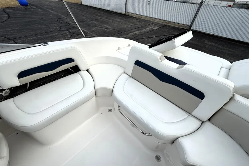 Slide: The Image of 2013 Chaparral 246 SSi boat interior with white and blue seating. - 22