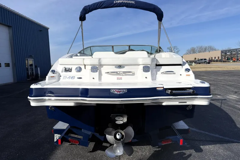 Slide: The Image of Rear view of a 2013 Chaparral 246 SSi boat with blue and white exterior. - 6