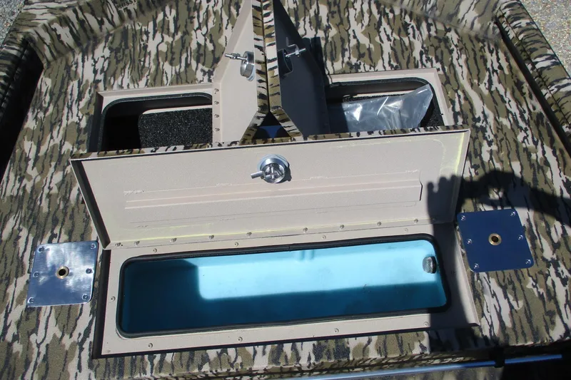 Slide: The Image of Interior compartments of 2026 Avid 18 Rogue CC boat with camouflage design. - 10