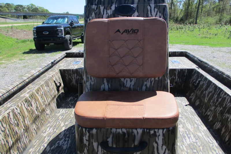 Slide: The Image of Avid 18 Rogue CC boat interior with camo design and leather seat, 2026 model. - 12