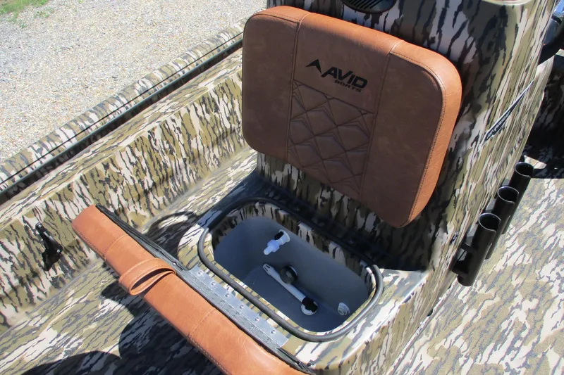 Slide: The Image of Camouflage-patterned Avid 18 Rogue CC boat interior with brown cushioned seat, 2026 model. - 13